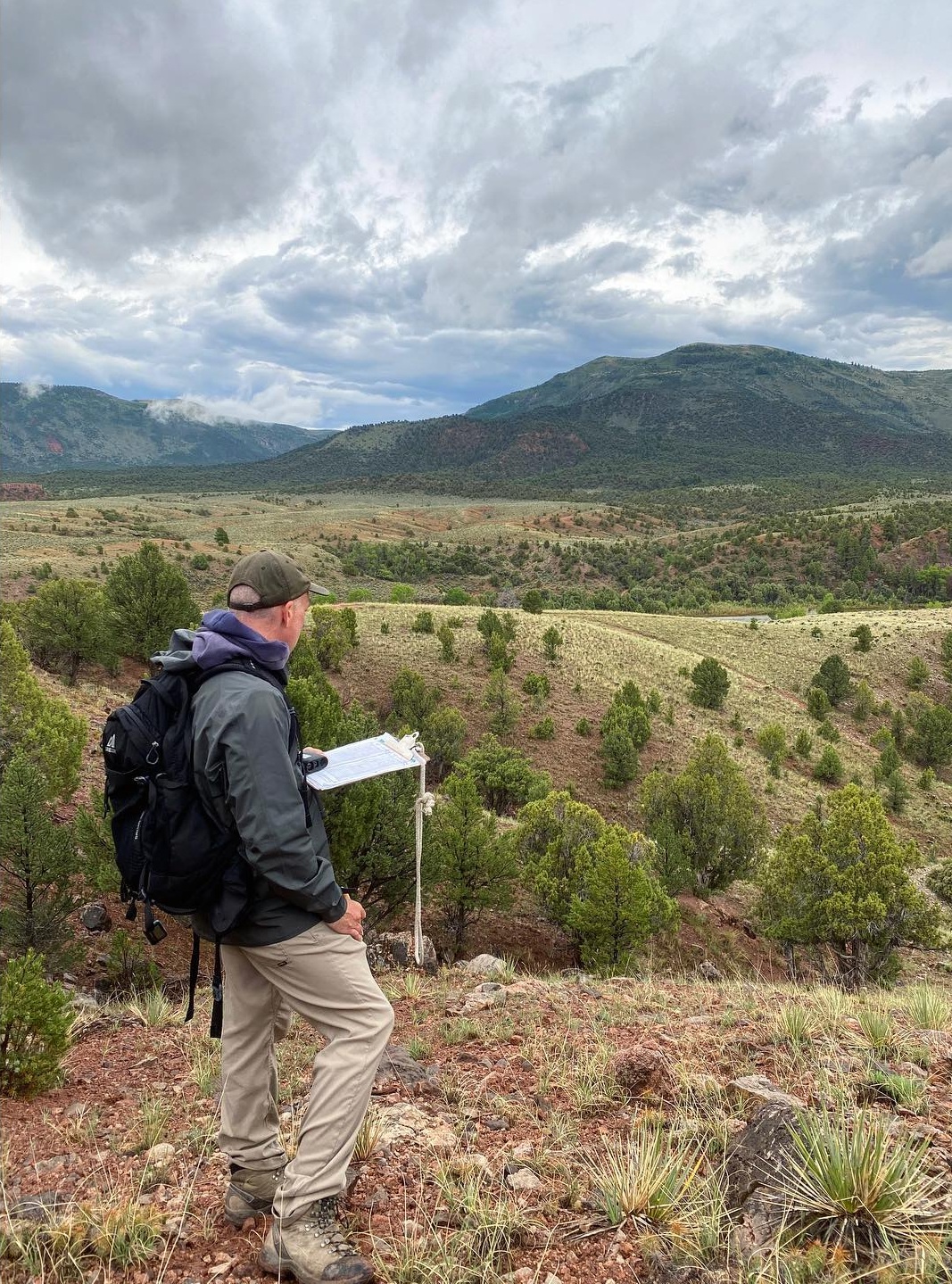 Logan conducting a field survey